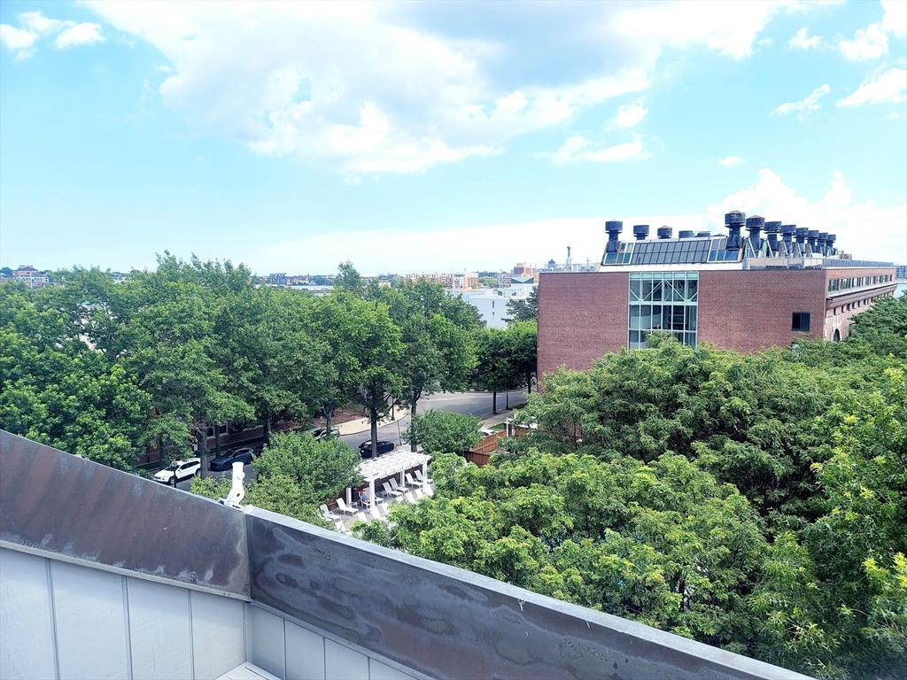 42 8th Street, Unit 2515 Boston, MA 02129 - Photo 3 of 29 a view of a balcony with wooden fence