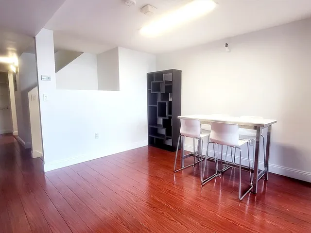 a view of a livingroom with furniture and wooden floor