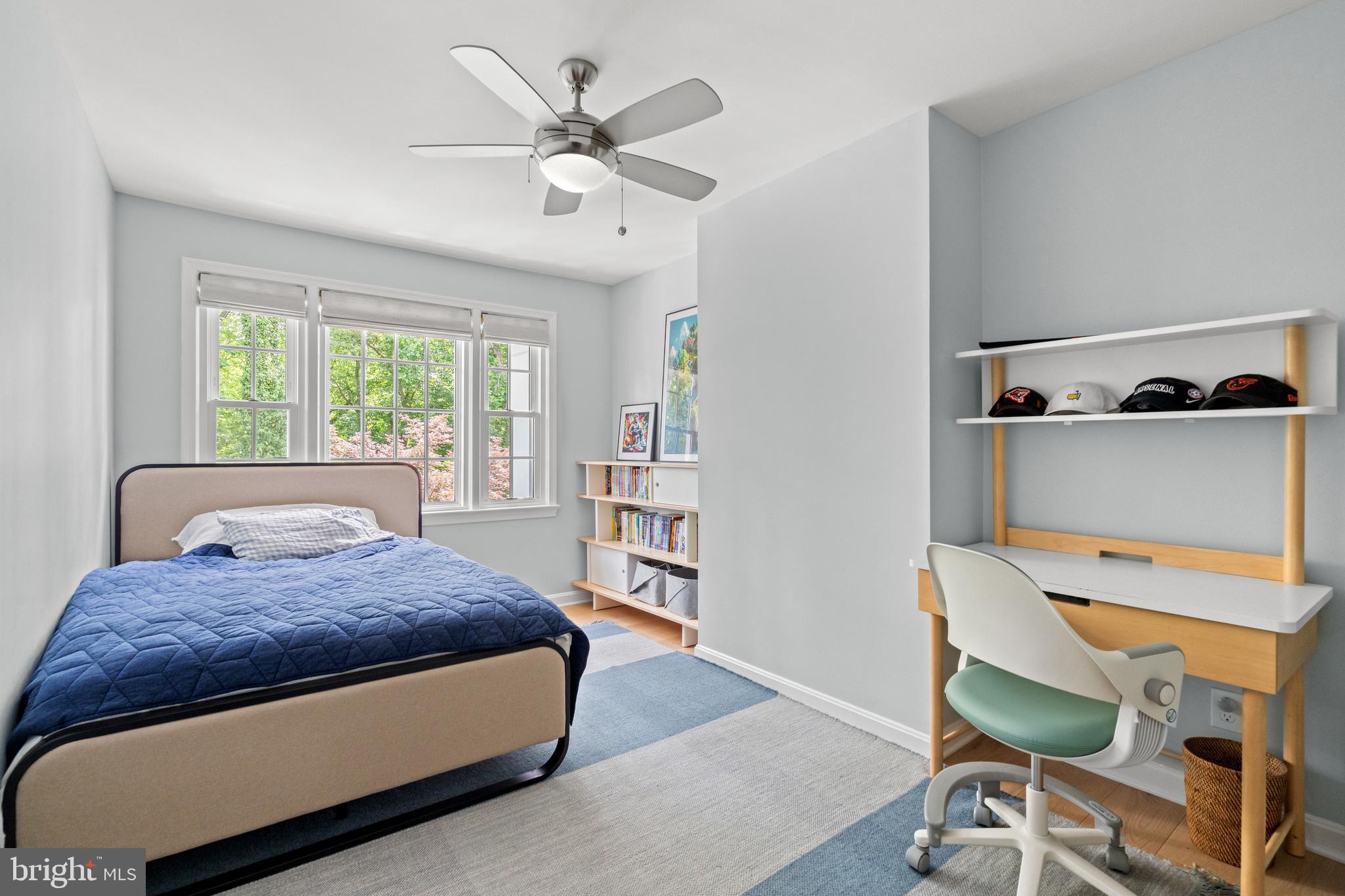 3527 Hamlet Place Chevy Chase, MD 20815 - Photo 12 of 19 a bedroom with a large bed and a chandelier