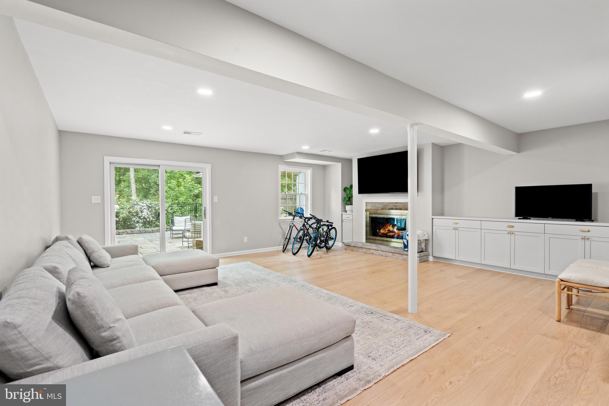 3527 Hamlet Place Chevy Chase, MD 20815 - Photo 14 of 19 a living room with furniture and a flat screen tv