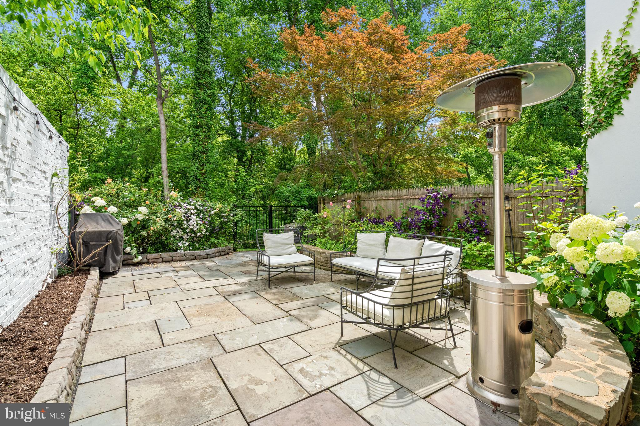 3527 Hamlet Place Chevy Chase, MD 20815 - Photo 17 of 19 a view of backyard with a table and chairs and potted plants