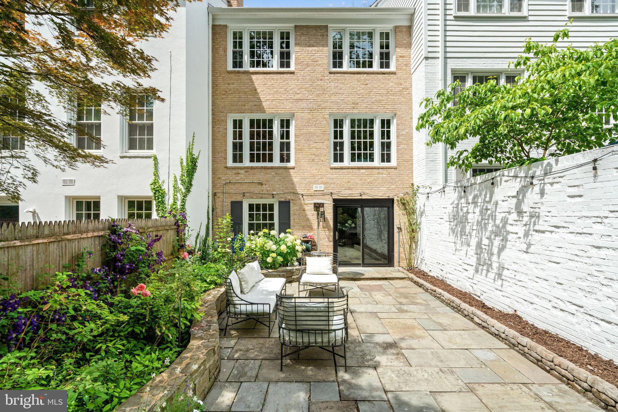 3527 Hamlet Place Chevy Chase, MD 20815 - Photo 18 of 19 a house with potted plants in front of it