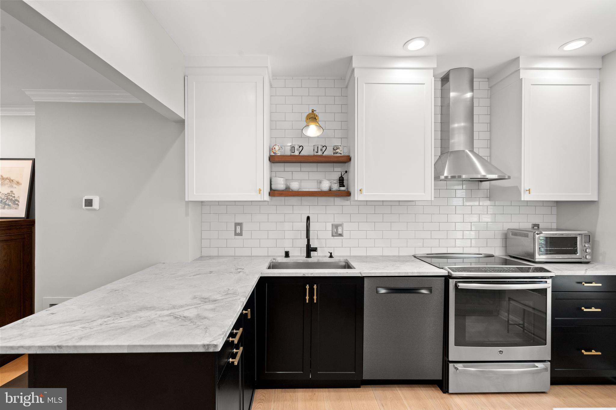3527 Hamlet Place Chevy Chase, MD 20815 - Photo 6 of 19 a kitchen with a sink stove and cabinets