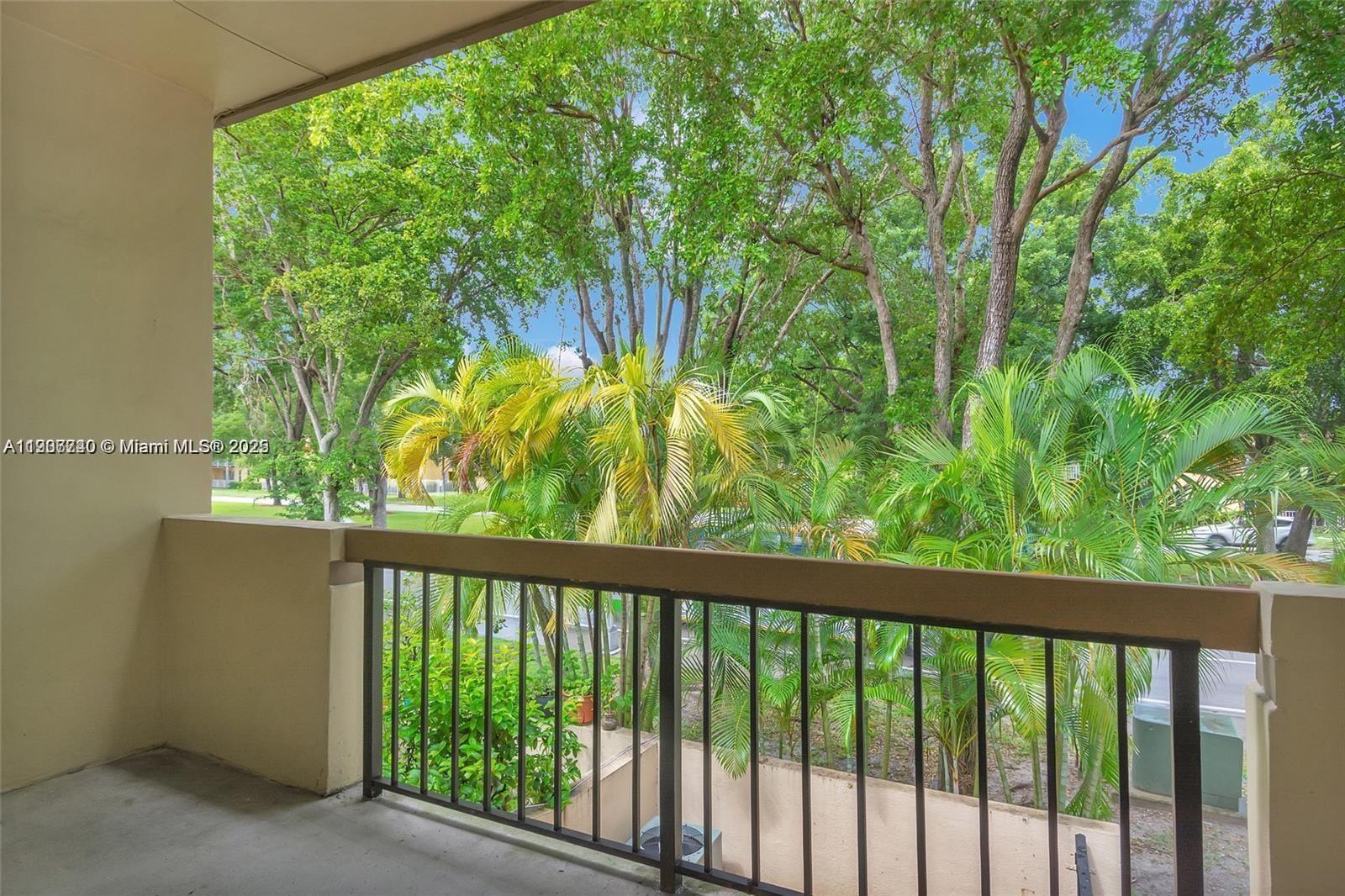 6236 Southwest 136th Court, Unit B105 Miami, FL 33183 - Photo 19 of 22 a view of a porch and a yard