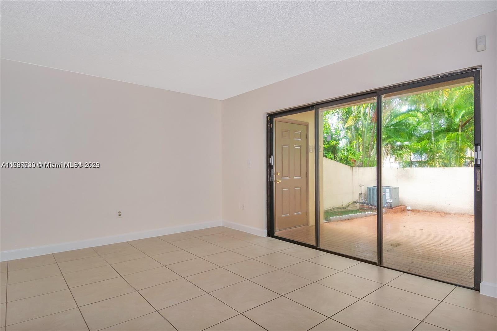6236 Southwest 136th Court, Unit B105 Miami, FL 33183 - Photo 7 of 22 a view of empty room with wooden floor and fan