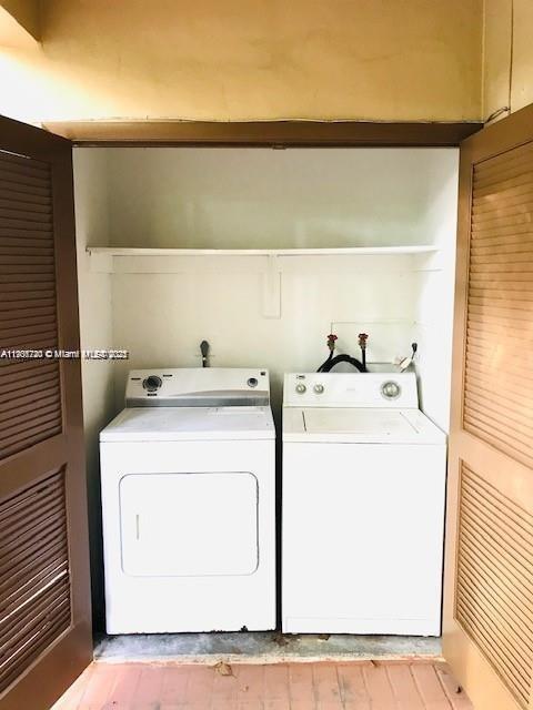 6236 Southwest 136th Court, Unit B105 Miami, FL 33183 - Photo 10 of 22 a utility room with dryer and washer