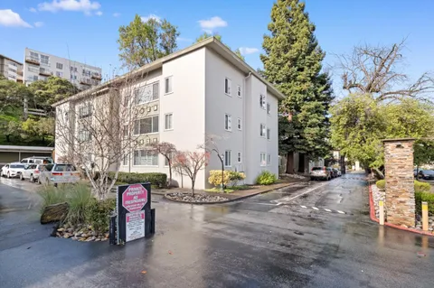 a view of a chair and table in the patio