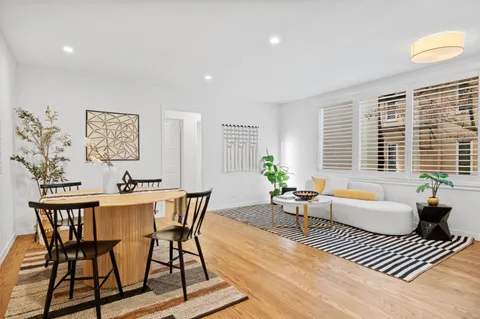 a living room with furniture and window