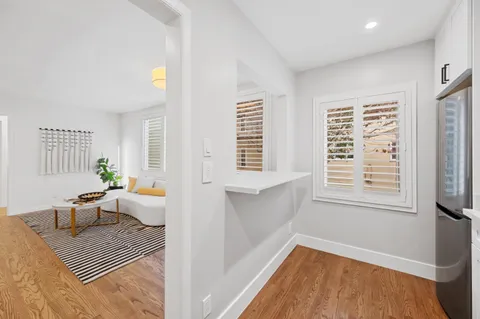 a view of a living room and dining room