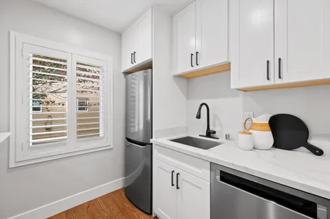 a kitchen with a sink and cabinets