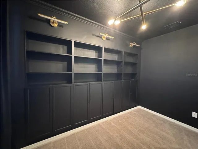 a view of empty room with empty racks