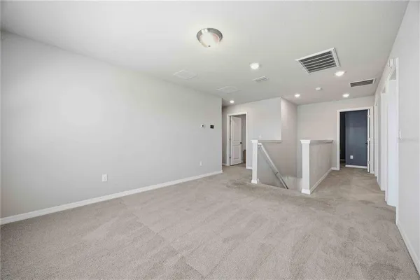 a view of a livingroom with a staircase