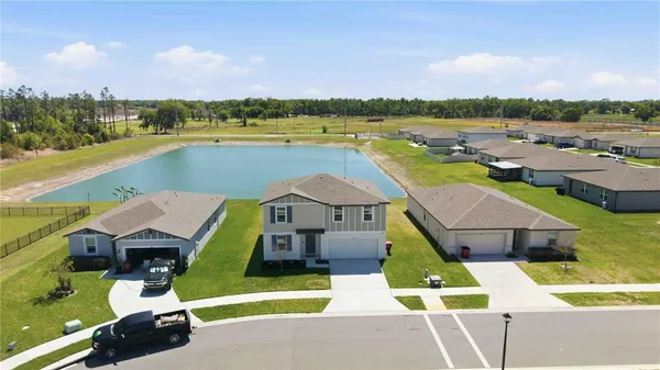 swimming pool view with a lake view
