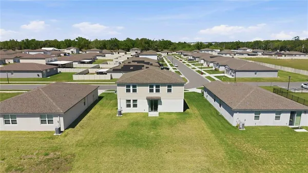 an aerial view of a house with a garden