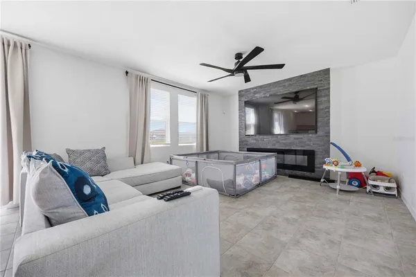 a living room with furniture and a fireplace