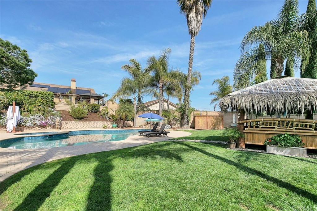 1306 Altura San Clemente, CA 92673 - Photo 24 of 28 Salt water pool newly refinished with pebble tec and a grass area with plenty of room for games!