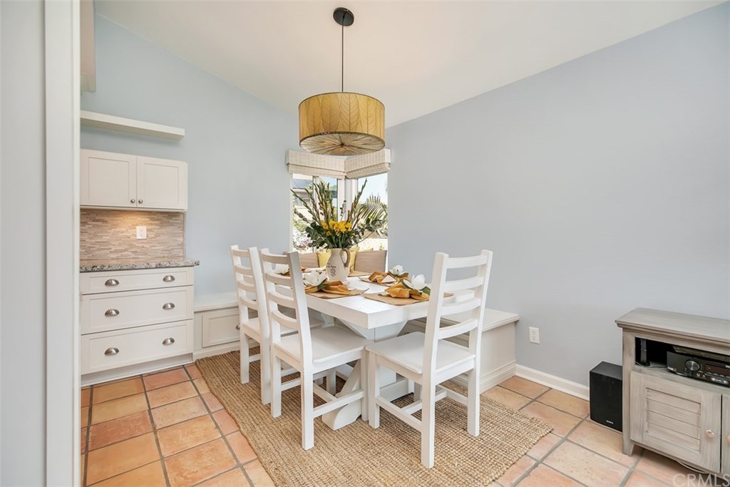 1306 Altura San Clemente, CA 92673 - Photo 5 of 28 Inviting dinning room with a custom built-in sitting area with plenty of storage.