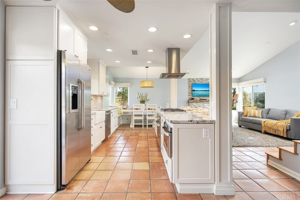 1306 Altura San Clemente, CA 92673 - Photo 7 of 28 This open floor concept home has an elegant kitchen! With every detail thought out down to the built in microwave.
