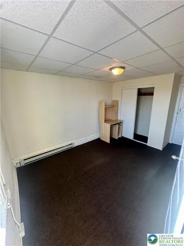 a view of room with window and stairs