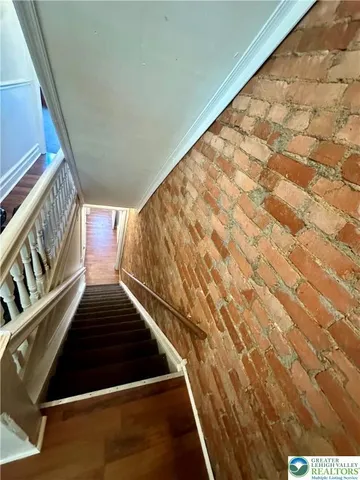 a kitchen with stainless steel appliances granite countertop a stove and a refrigerator