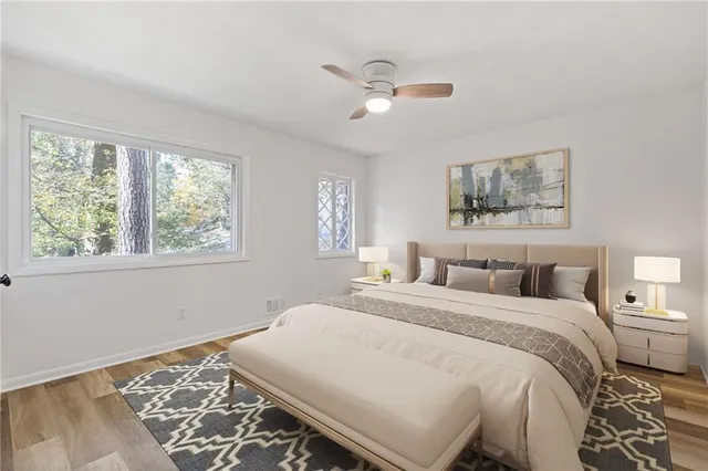 a bedroom with a large bed and a window