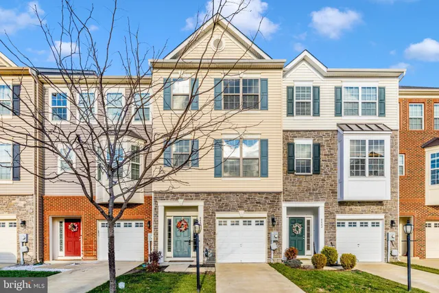 a view of a brick house with a yard