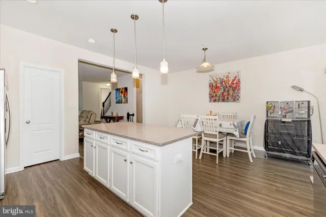 a view of a kitchen and dining room