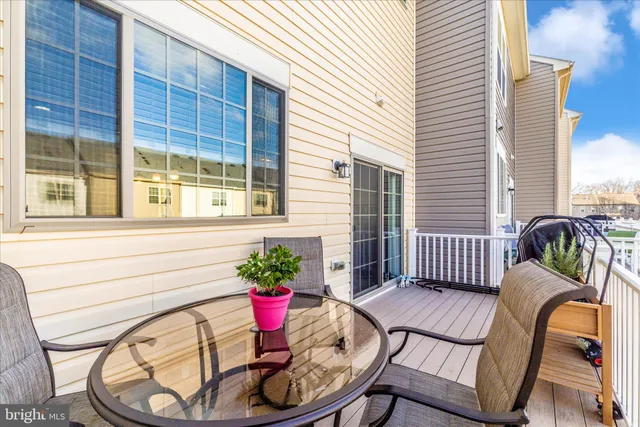 a view of a balcony with chair and potted plant