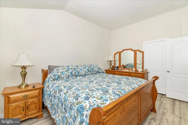 a bedroom with a bed and dresser