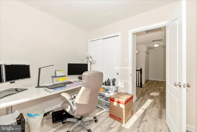 a view of a workspace with furniture