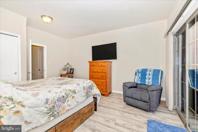 a bedroom with a bed and a television