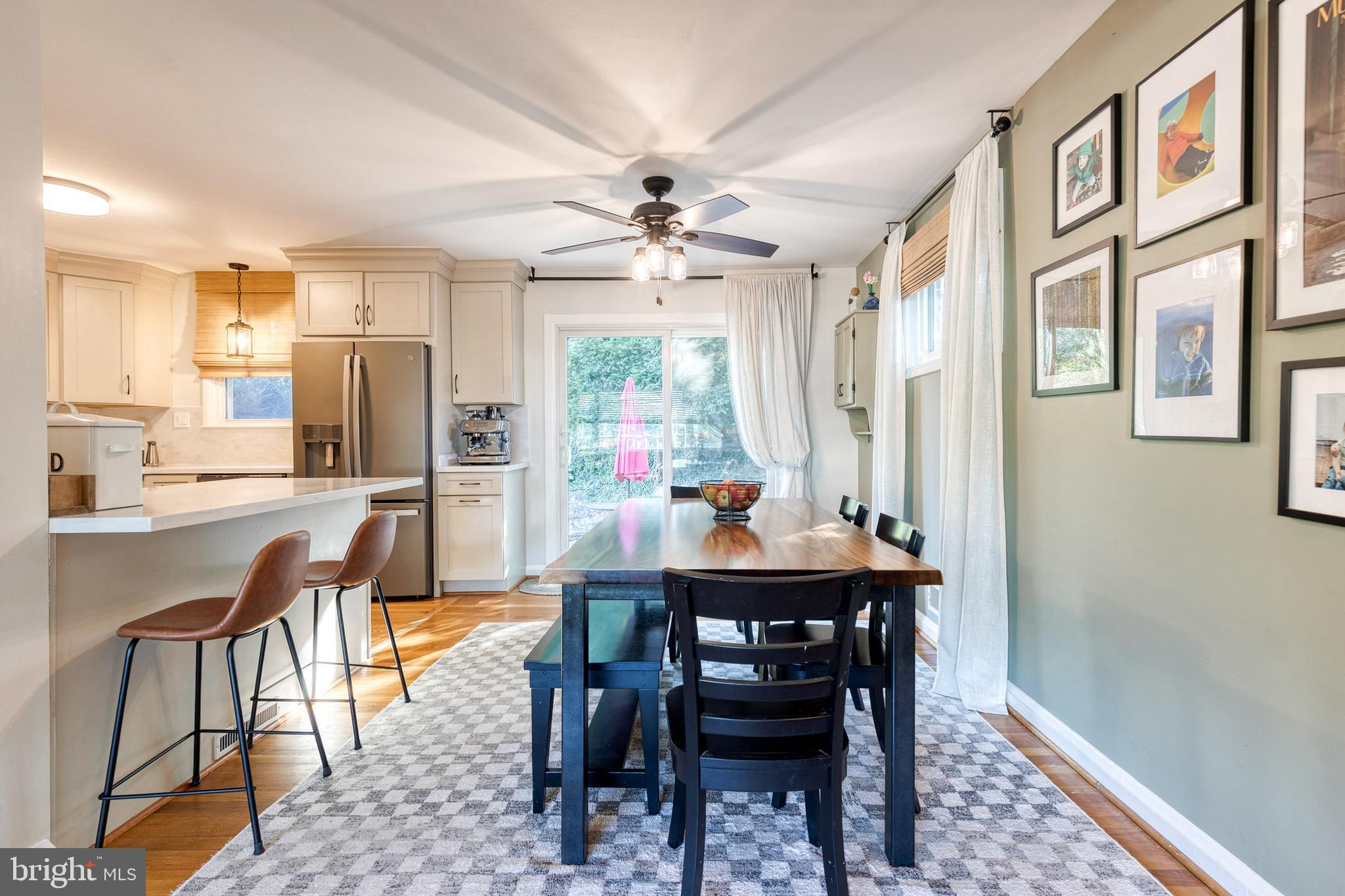 1 North Hilltop Road Baltimore, MD 21228 - Photo 11 of 36 a view of a dining room with furniture window and wooden floor
