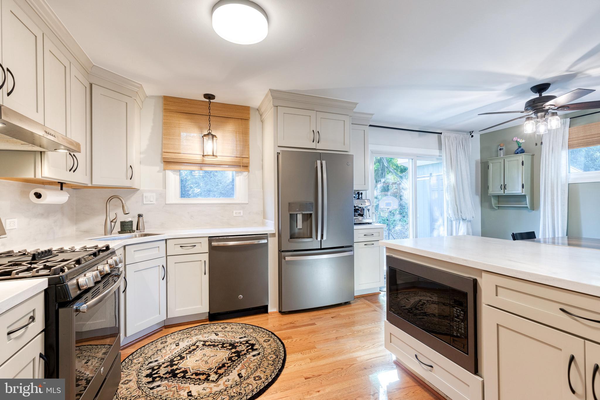 1 North Hilltop Road Baltimore, MD 21228 - Photo 17 of 36 a kitchen with a stove sink and refrigerator