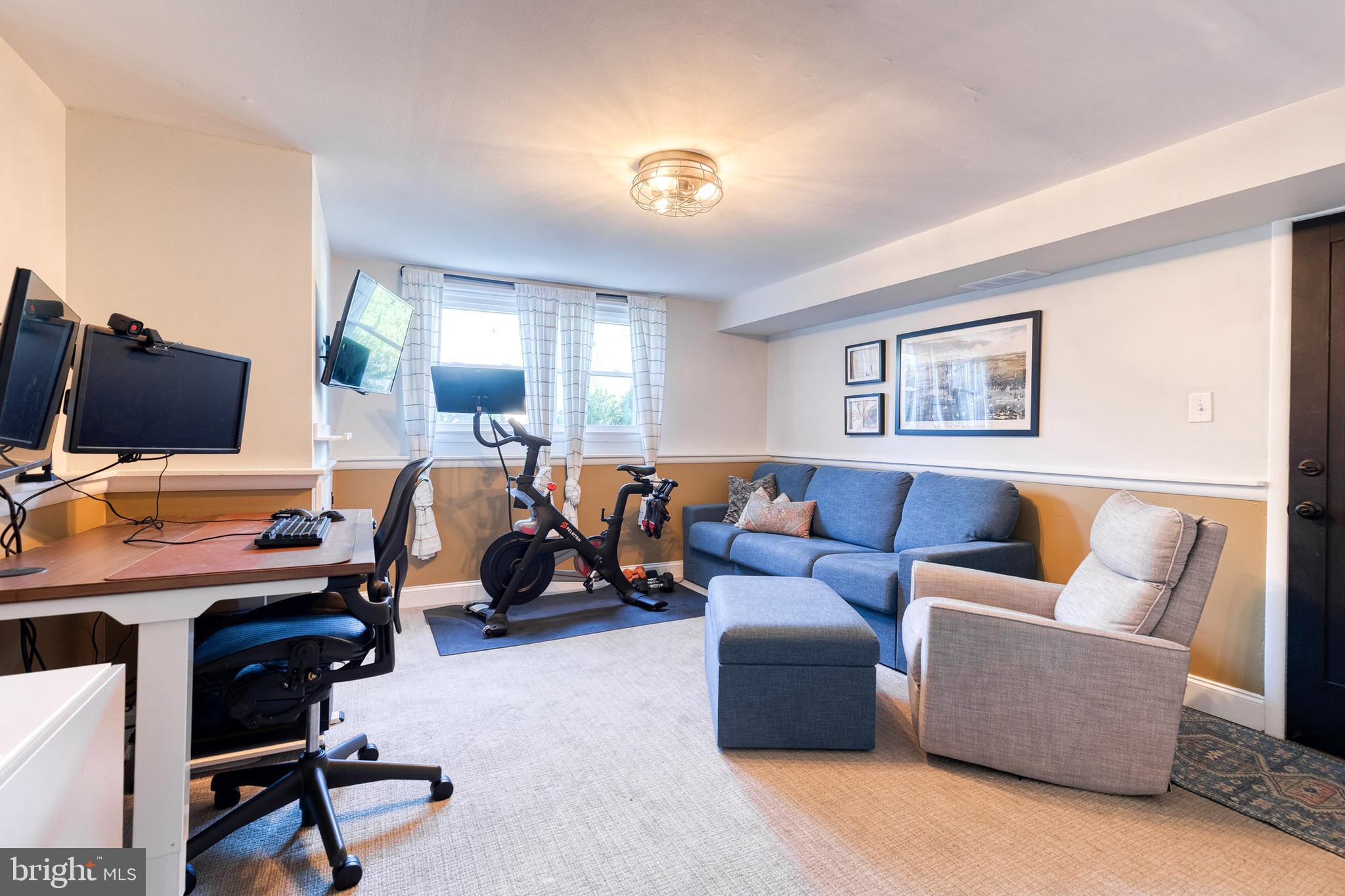 1 North Hilltop Road Baltimore, MD 21228 - Photo 29 of 36 a living room with furniture a flat screen tv and a window