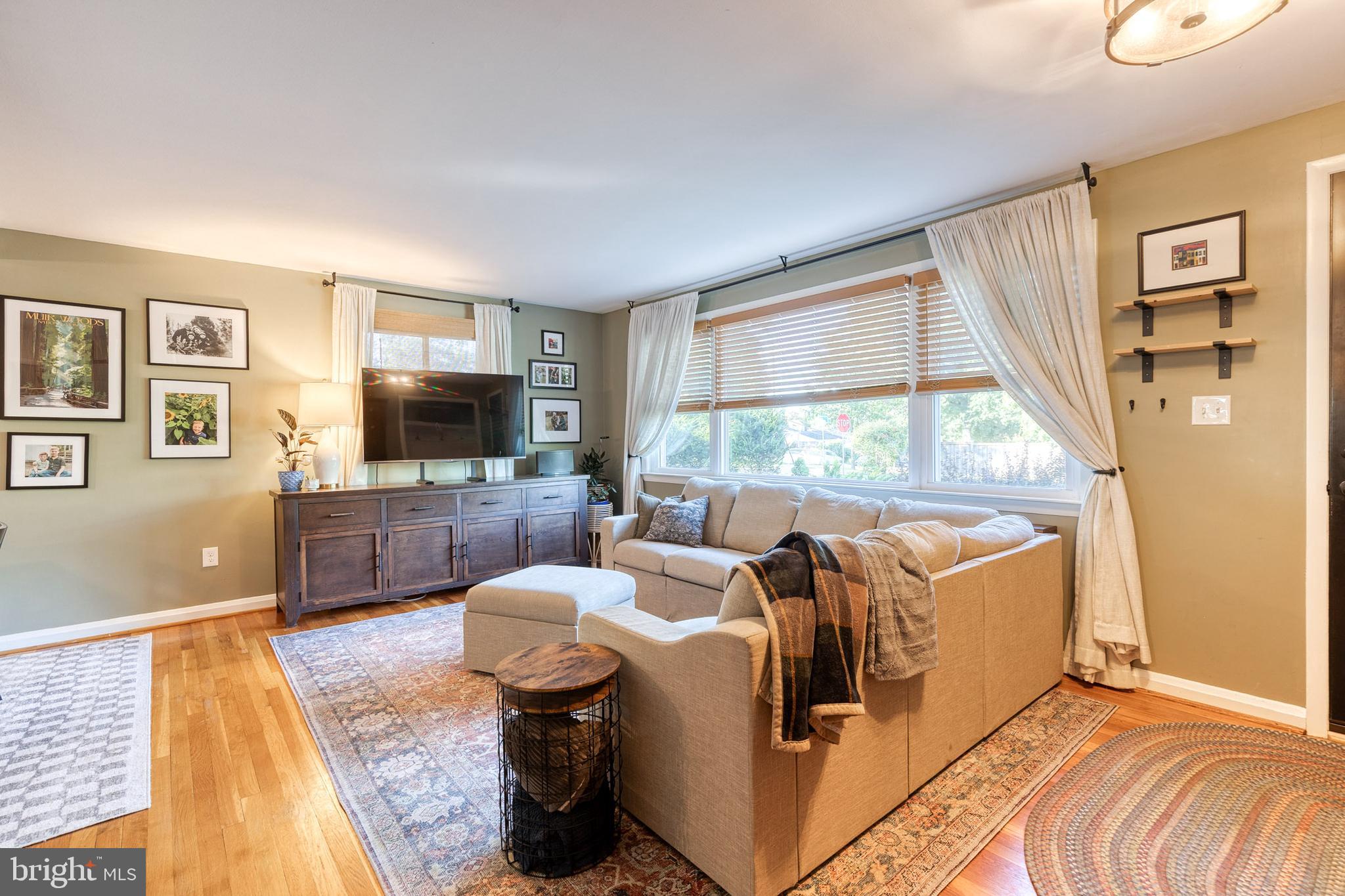 1 North Hilltop Road Baltimore, MD 21228 - Photo 5 of 36 a living room with furniture and a flat screen tv