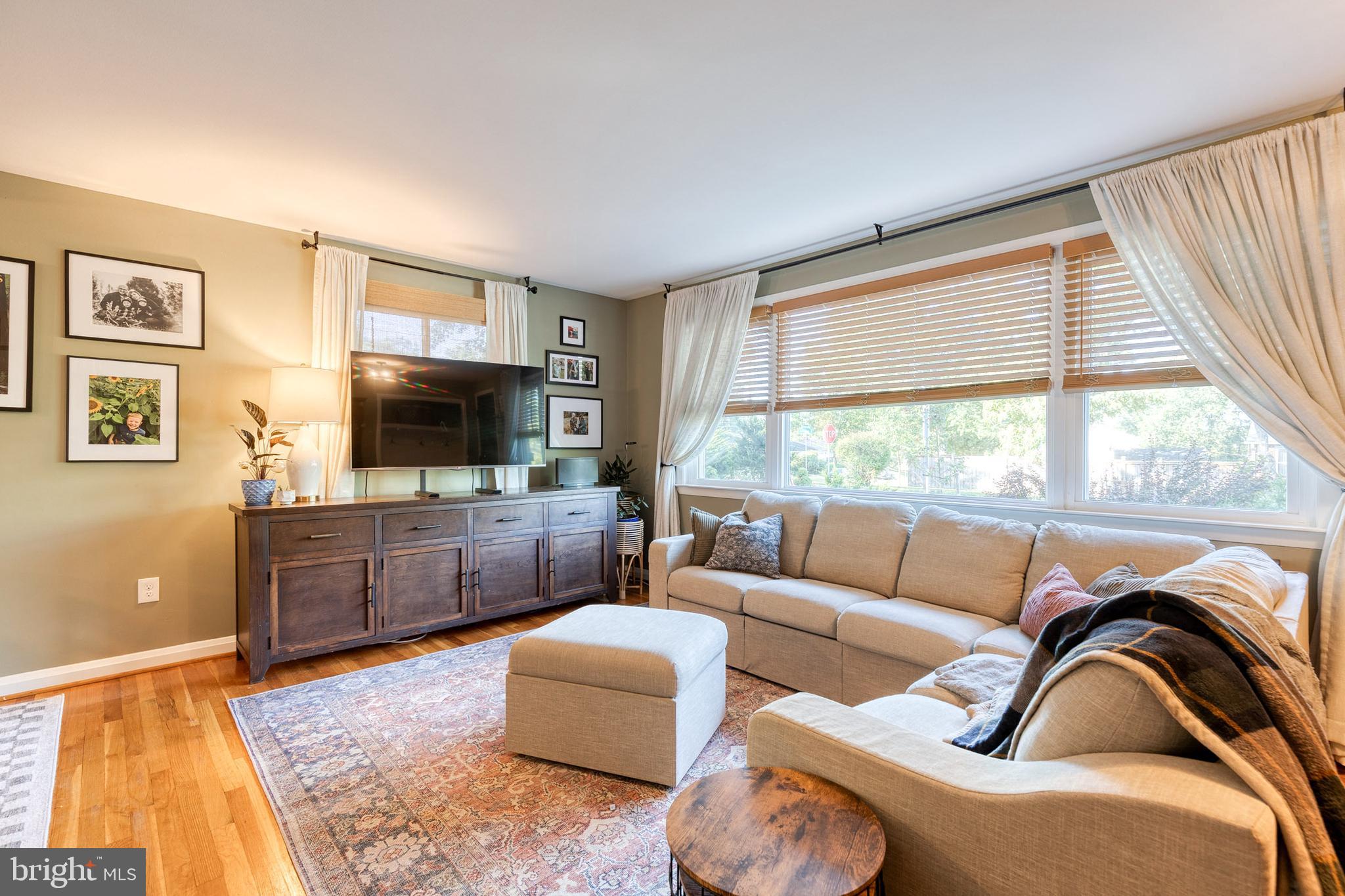 1 North Hilltop Road Baltimore, MD 21228 - Photo 7 of 36 a living room with furniture and a flat screen tv