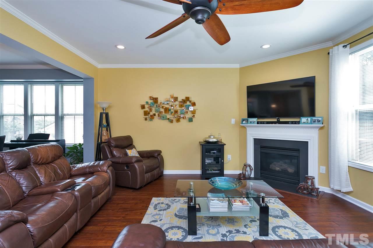 5639 Wade Park Boulevard Raleigh, NC 27607 - Photo 11 of 24 a living room with furniture and a flat screen tv