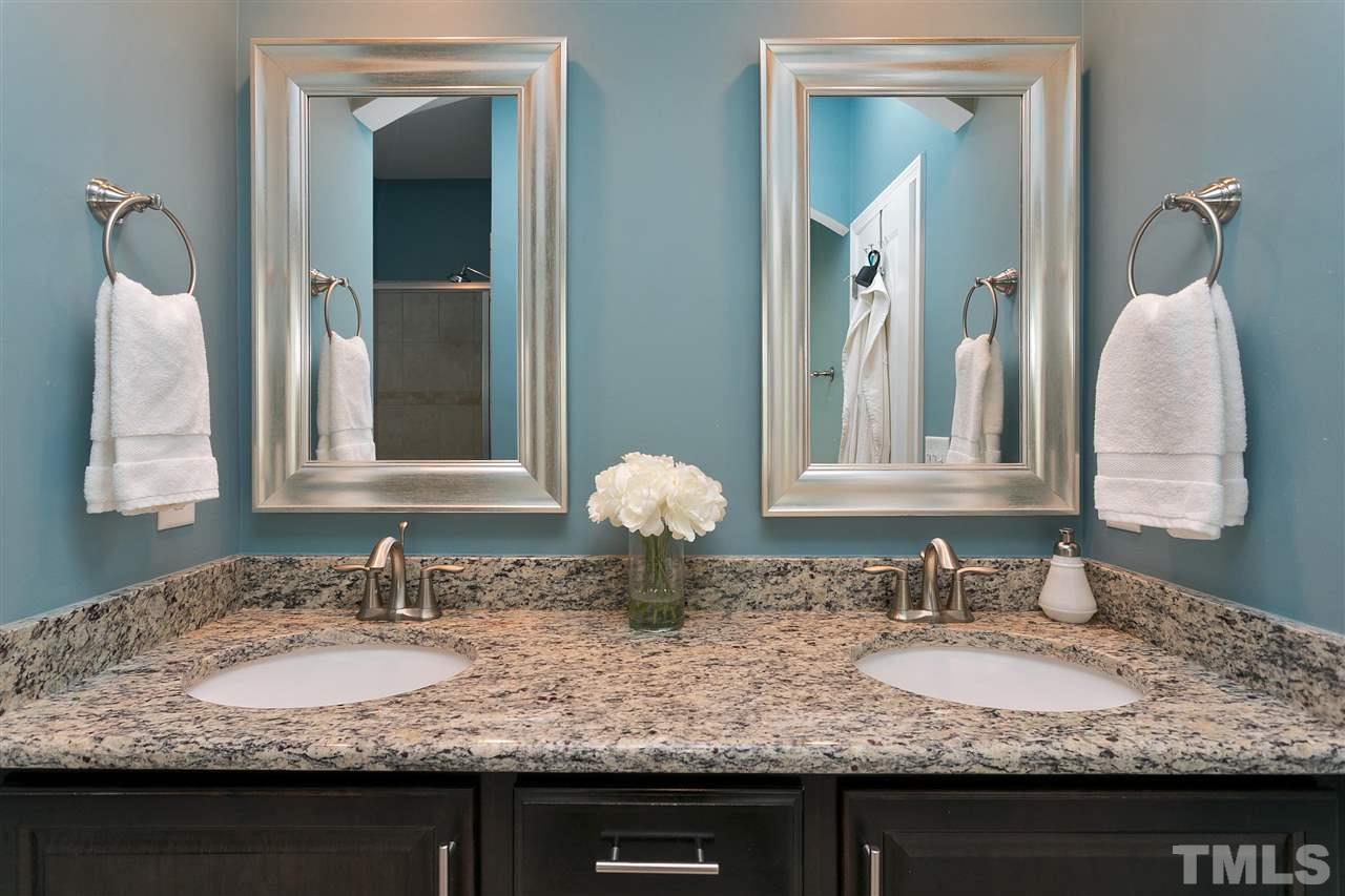 5639 Wade Park Boulevard Raleigh, NC 27607 - Photo 15 of 24 a bathroom with granite countertop double vanity sinks and a mirror