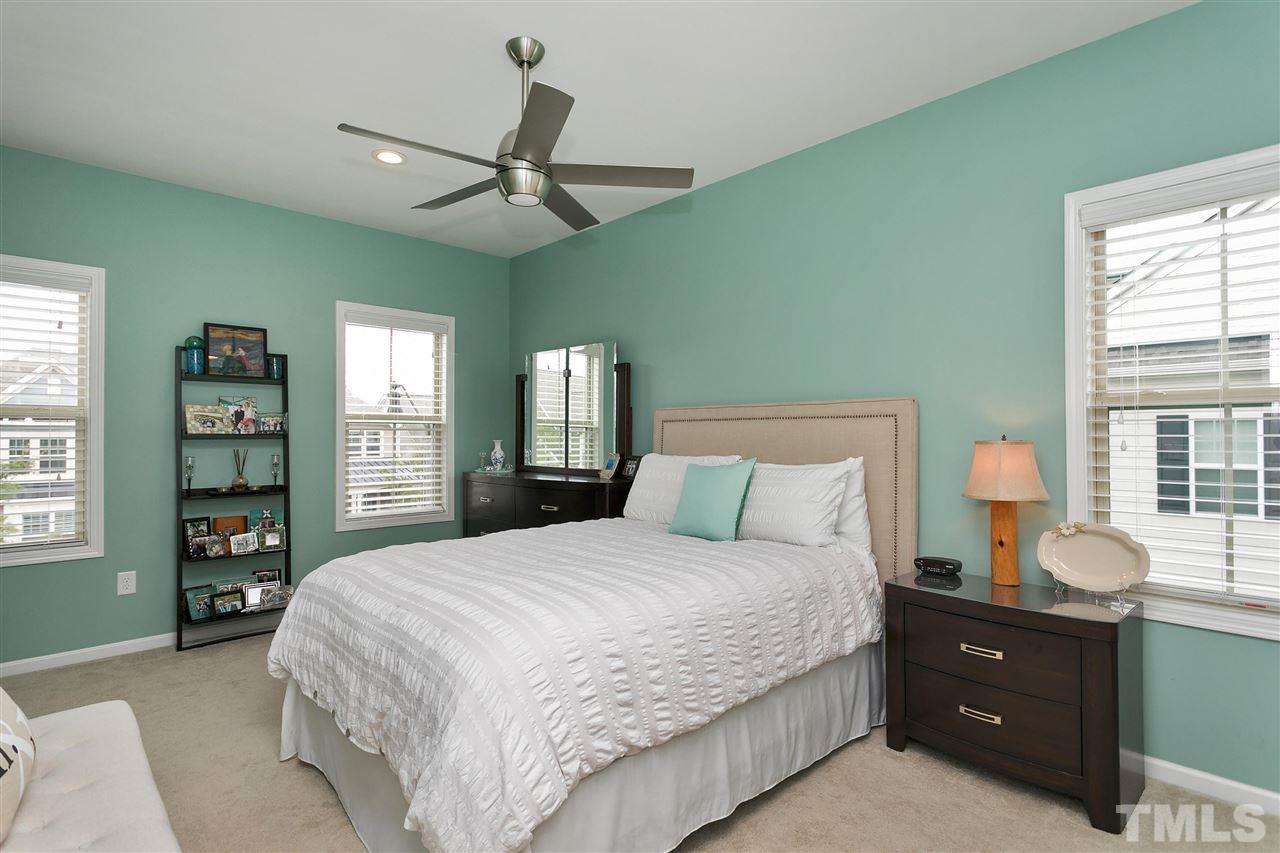 5639 Wade Park Boulevard Raleigh, NC 27607 - Photo 16 of 24 a bedroom with a large bed and a window