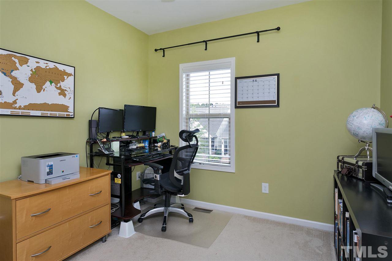 5639 Wade Park Boulevard Raleigh, NC 27607 - Photo 17 of 24 a view of a workspace with furniture and a window