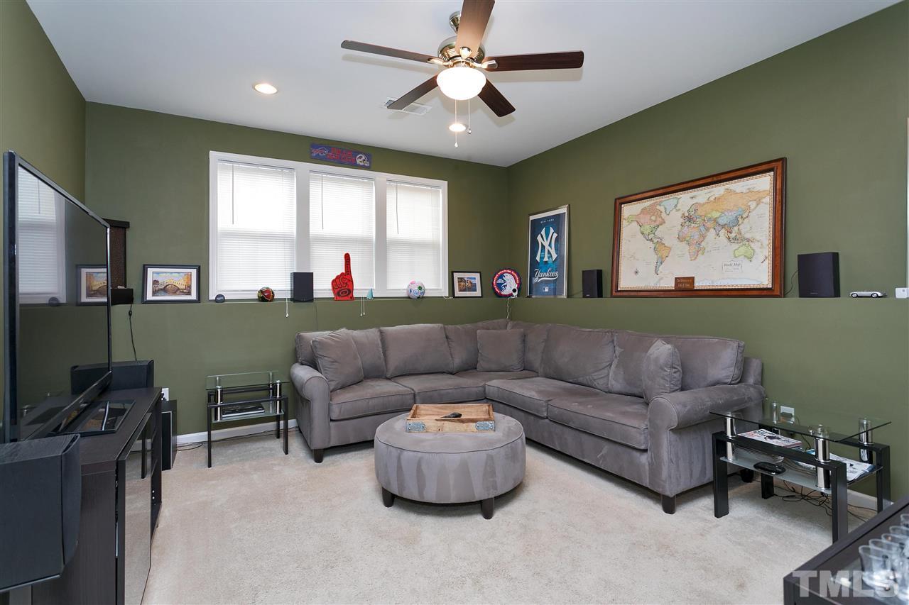 5639 Wade Park Boulevard Raleigh, NC 27607 - Photo 19 of 24 a living room with furniture and a window