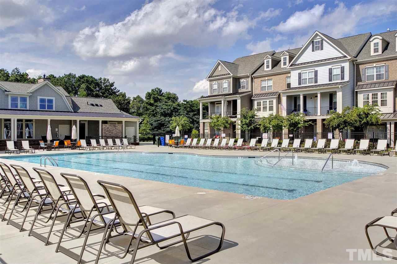 5639 Wade Park Boulevard Raleigh, NC 27607 - Photo 24 of 24 a front view of a house with swimming pool and porch
