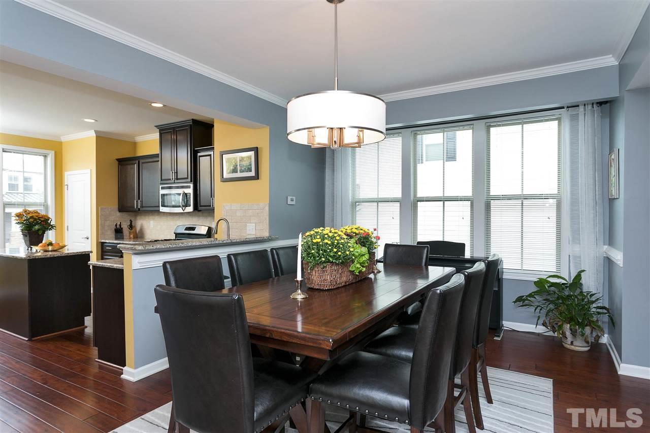5639 Wade Park Boulevard Raleigh, NC 27607 - Photo 7 of 24 a view of a dining room with furniture window and wooden floor