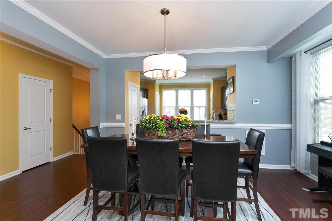 5639 Wade Park Boulevard Raleigh, NC 27607 - Photo 8 of 24 a dining room with furniture window and wooden floor