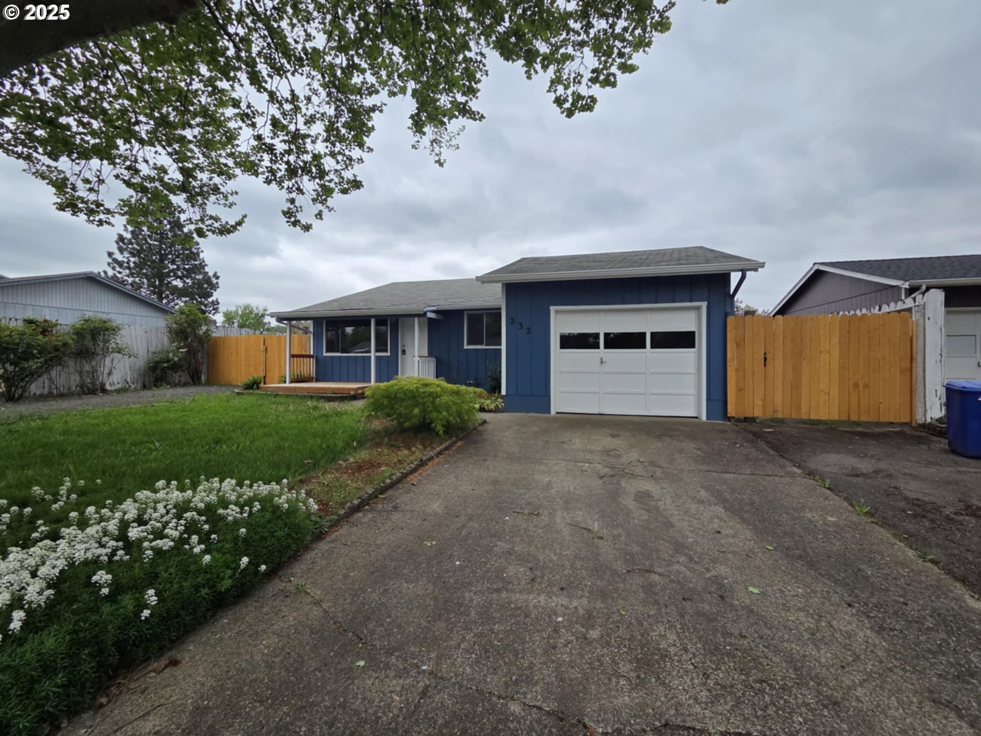 232 Columbia Loop Road Roseburg, OR 97471 - Photo 1 of 19 a front view of a house with a yard and garage