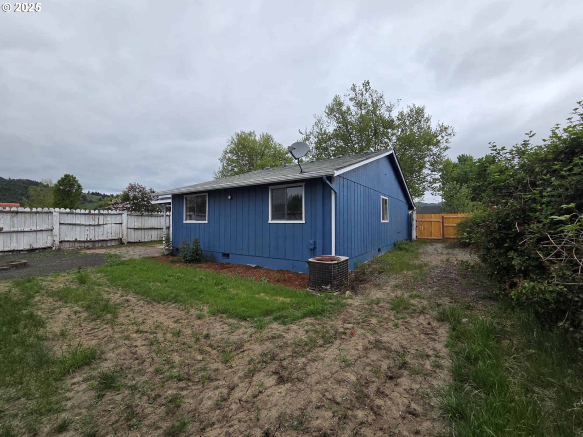 232 Columbia Loop Road Roseburg, OR 97471 - Photo 11 of 19 a backyard of a house with lots of green space
