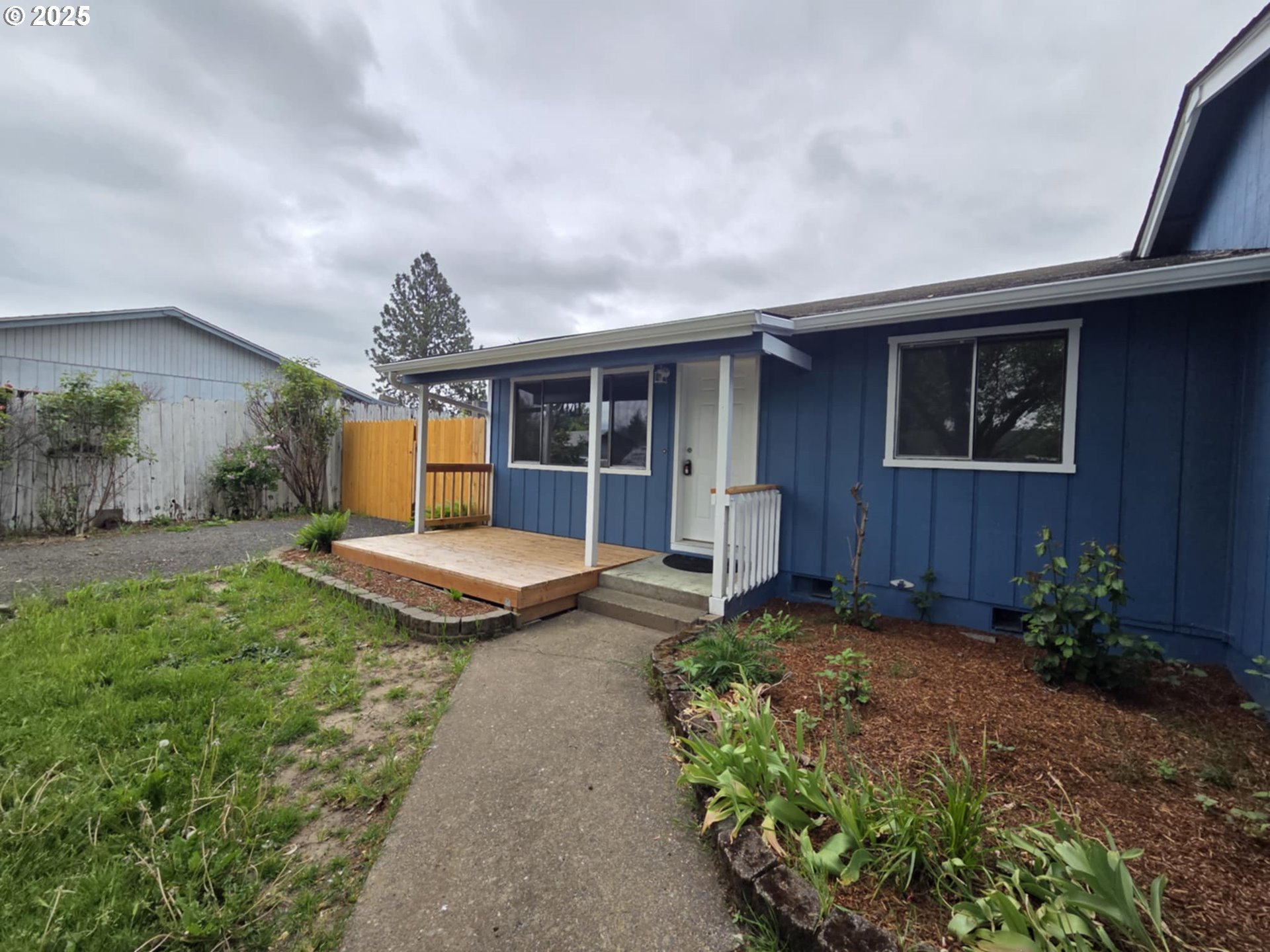 232 Columbia Loop Road Roseburg, OR 97471 - Photo 3 of 19 a front view of a house with a yard
