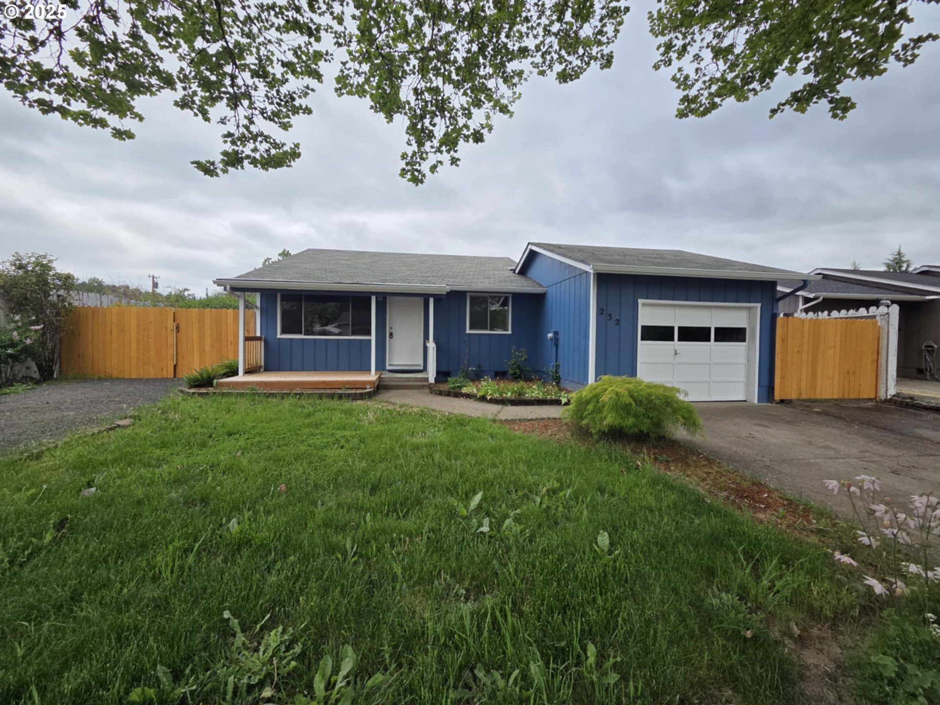 232 Columbia Loop Road Roseburg, OR 97471 - Photo 6 of 19 a front view of house with yard and outdoor seating