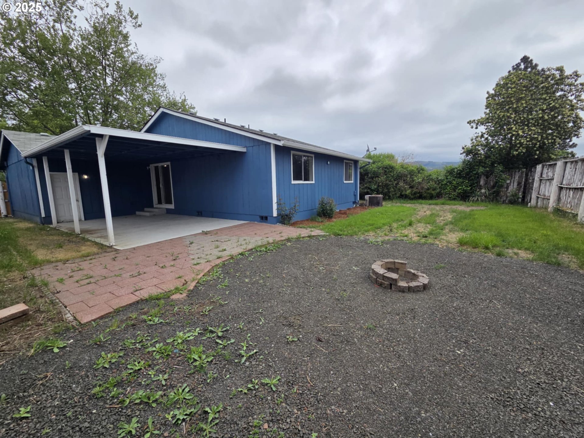 232 Columbia Loop Road Roseburg, OR 97471 - Photo 9 of 19 a view of a backyard with large trees