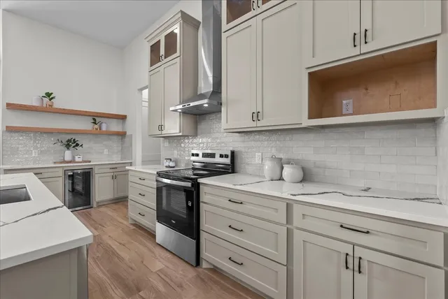 a dining room with wooden floor a glass table and chairs